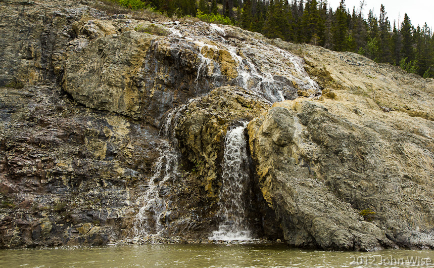 Riverside cascade tumbling into the Alsek River in Yukon, Canada